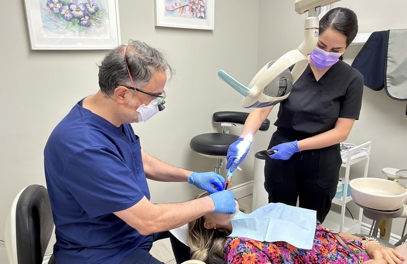 Dentist providing cosmetic dental treatment at Hola Dentistry in Bradford