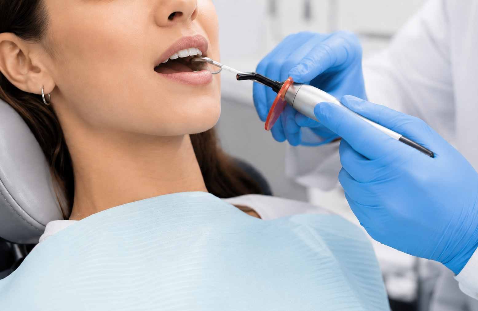 Bradford dentist applying a tooth-coloured composite resin filling to a tooth comfortbly